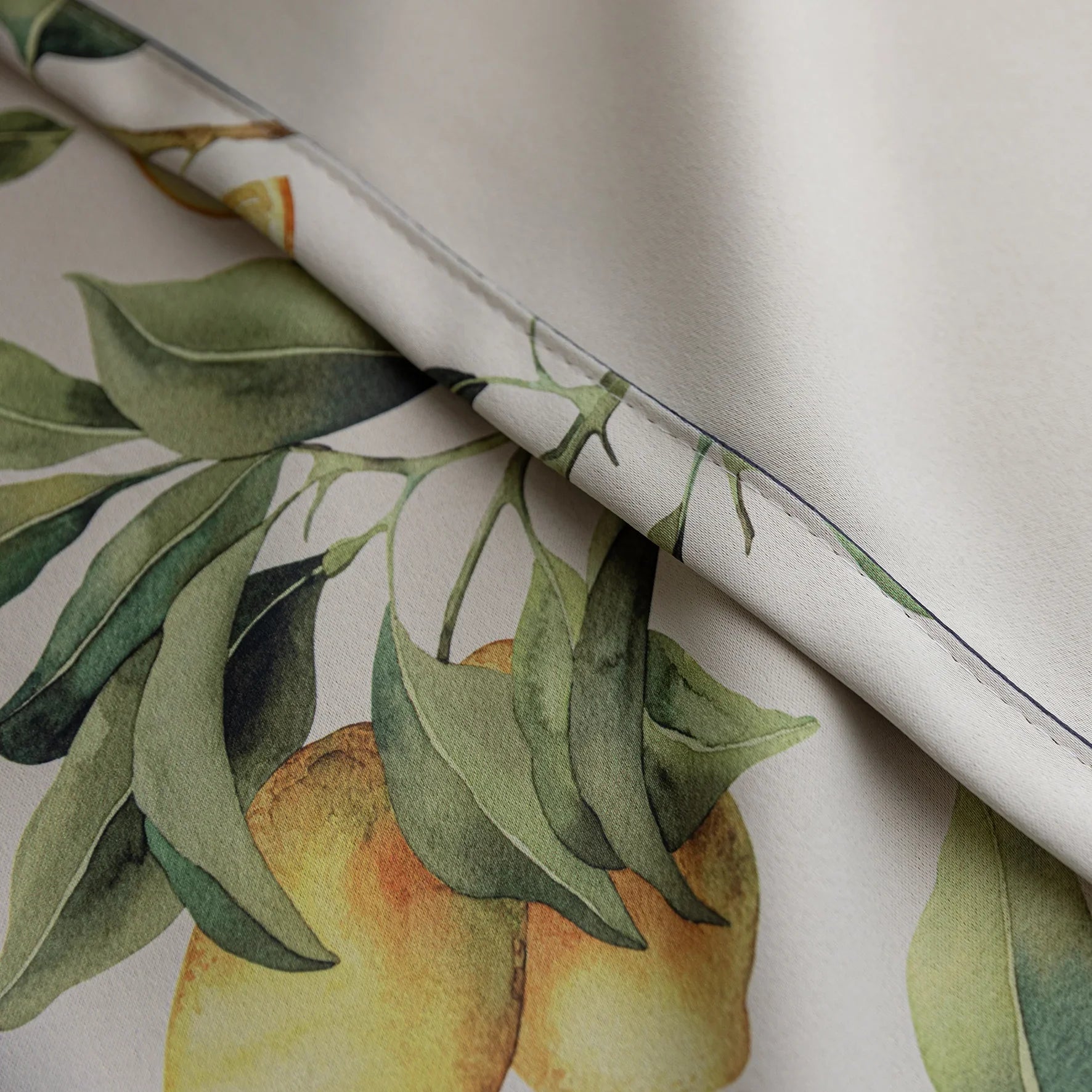 Fresh and vibrant lemon-print blackout curtain featuring lush green leaves and golden citrus fruits, perfect for adding a cheerful Mediterranean touch while blocking sunlight and ensuring privacy in your home.