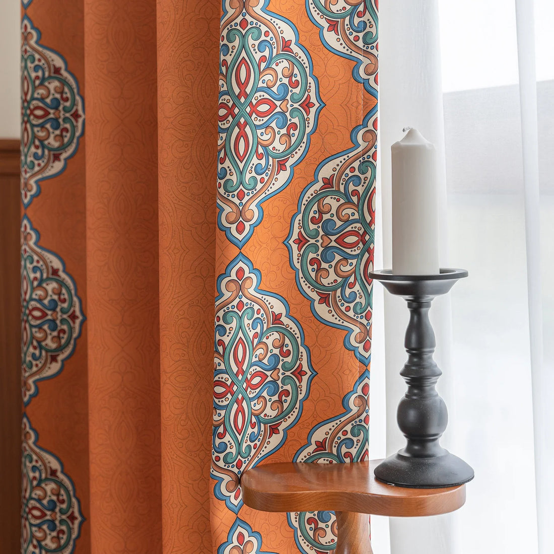 Stylish burnt orange blackout curtain with intricate medallion border design, blending vibrant color with elegant patterns to provide privacy, block sunlight, and enhance any living or bedroom décor.