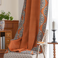 Stylish burnt orange blackout curtain with intricate medallion border design, blending vibrant color with elegant patterns to provide privacy, block sunlight, and enhance any living or bedroom décor.