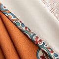 Stylish burnt orange blackout curtain with intricate medallion border design, blending vibrant color with elegant patterns to provide privacy, block sunlight, and enhance any living or bedroom décor.