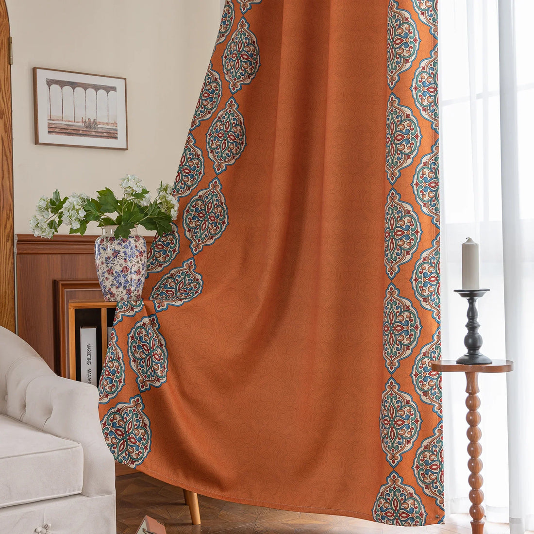 Stylish burnt orange blackout curtain with intricate medallion border design, blending vibrant color with elegant patterns to provide privacy, block sunlight, and enhance any living or bedroom décor.