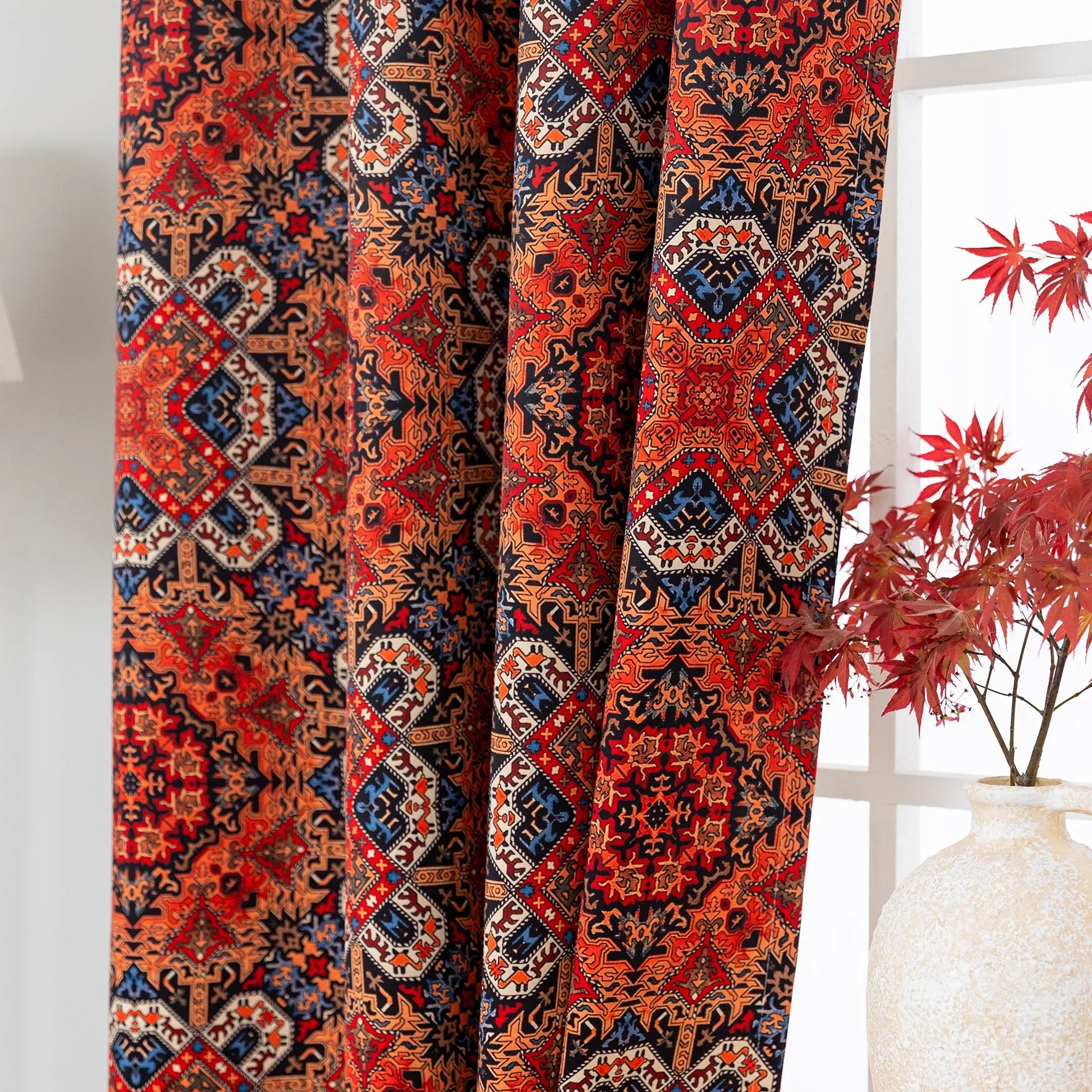 Persian-inspired blackout curtain featuring rich red, navy, and gold tones in an intricate geometric pattern, offering both timeless elegance and effective light-blocking for a warm, stylish home.