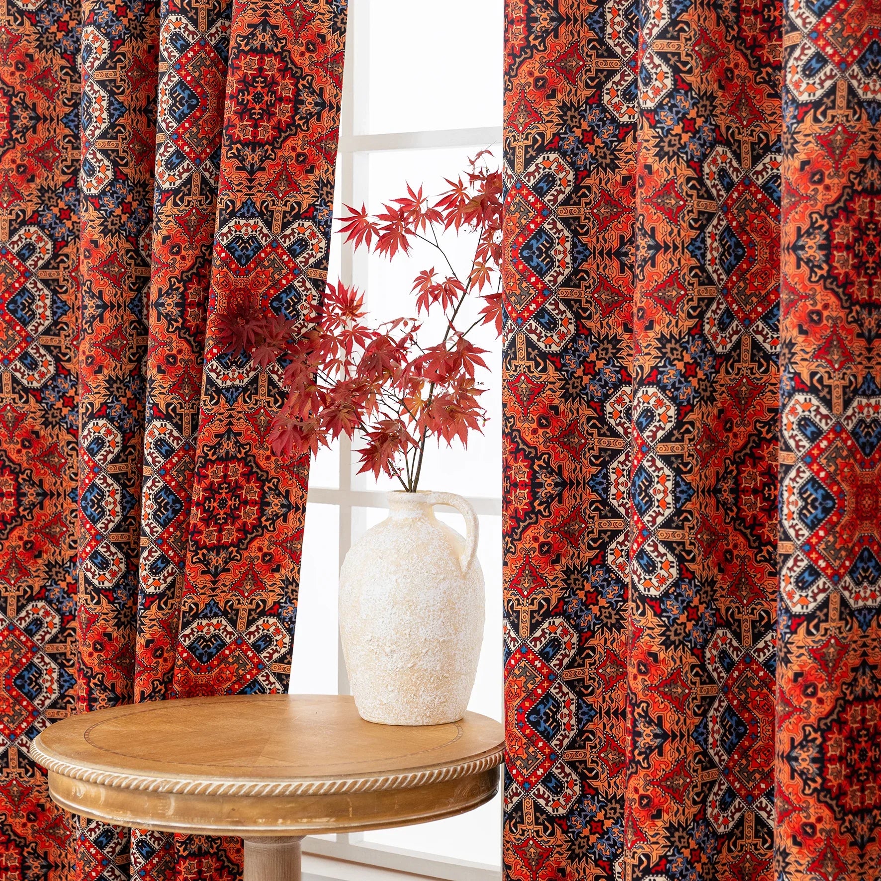 Persian-inspired blackout curtain featuring rich red, navy, and gold tones in an intricate geometric pattern, offering both timeless elegance and effective light-blocking for a warm, stylish home.