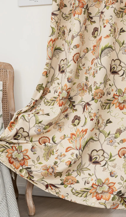 Vintage floral blackout curtain with warm orange and green tones on a beige background, combining classic charm with effective light-blocking and privacy for a cozy home atmosphere.