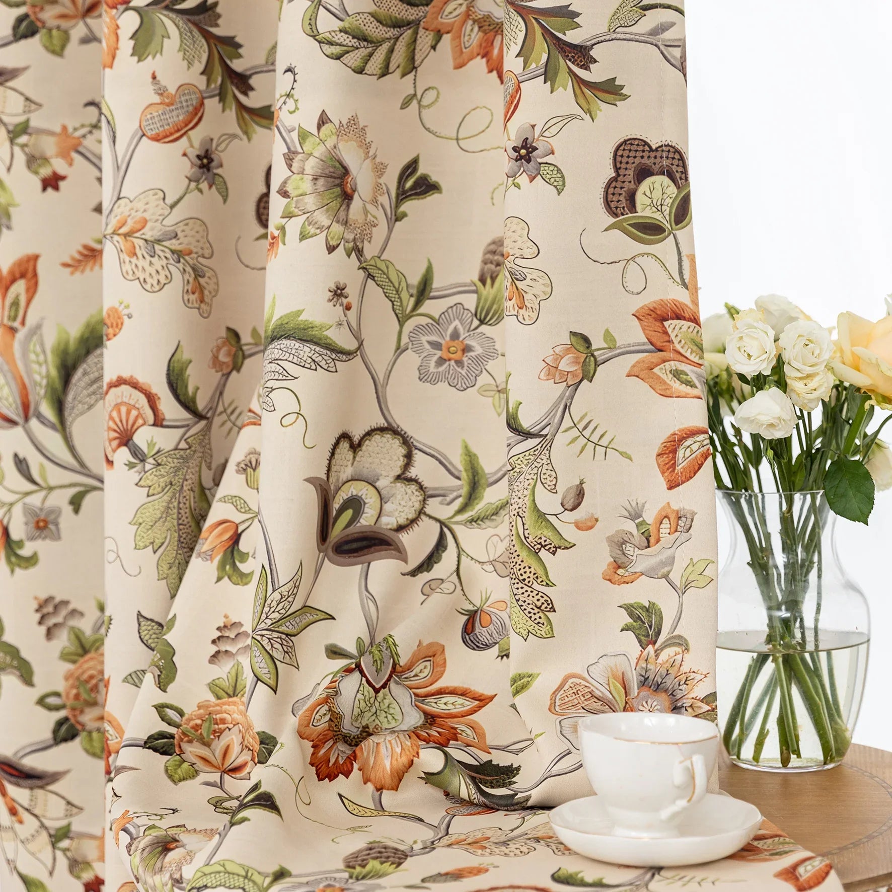 Vintage floral blackout curtain with warm orange and green tones on a beige background, combining classic charm with effective light-blocking and privacy for a cozy home atmosphere.