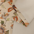 Vintage floral blackout curtain with warm orange and green tones on a beige background, combining classic charm with effective light-blocking and privacy for a cozy home atmosphere.