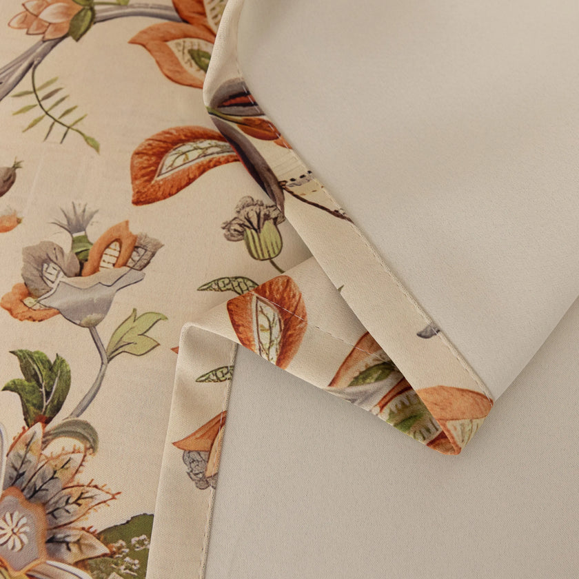 Vintage floral blackout curtain with warm orange and green tones on a beige background, combining classic charm with effective light-blocking and privacy for a cozy home atmosphere.