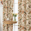 Vintage floral blackout curtain with warm orange and green tones on a beige background, combining classic charm with effective light-blocking and privacy for a cozy home atmosphere.