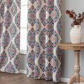 Elegant blackout curtain with blue and orange damask patterns on a cream background, offering stylish light-blocking and privacy for any room.