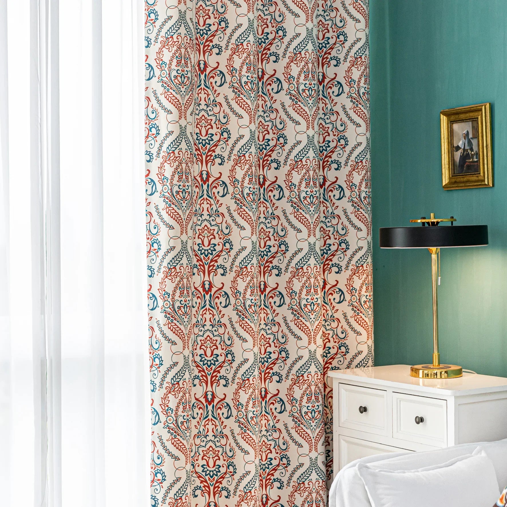 Elegant bohemian blackout curtain with intricate red and teal floral patterns on a soft beige background, designed to block sunlight, reduce noise, and add artistic charm to any room.