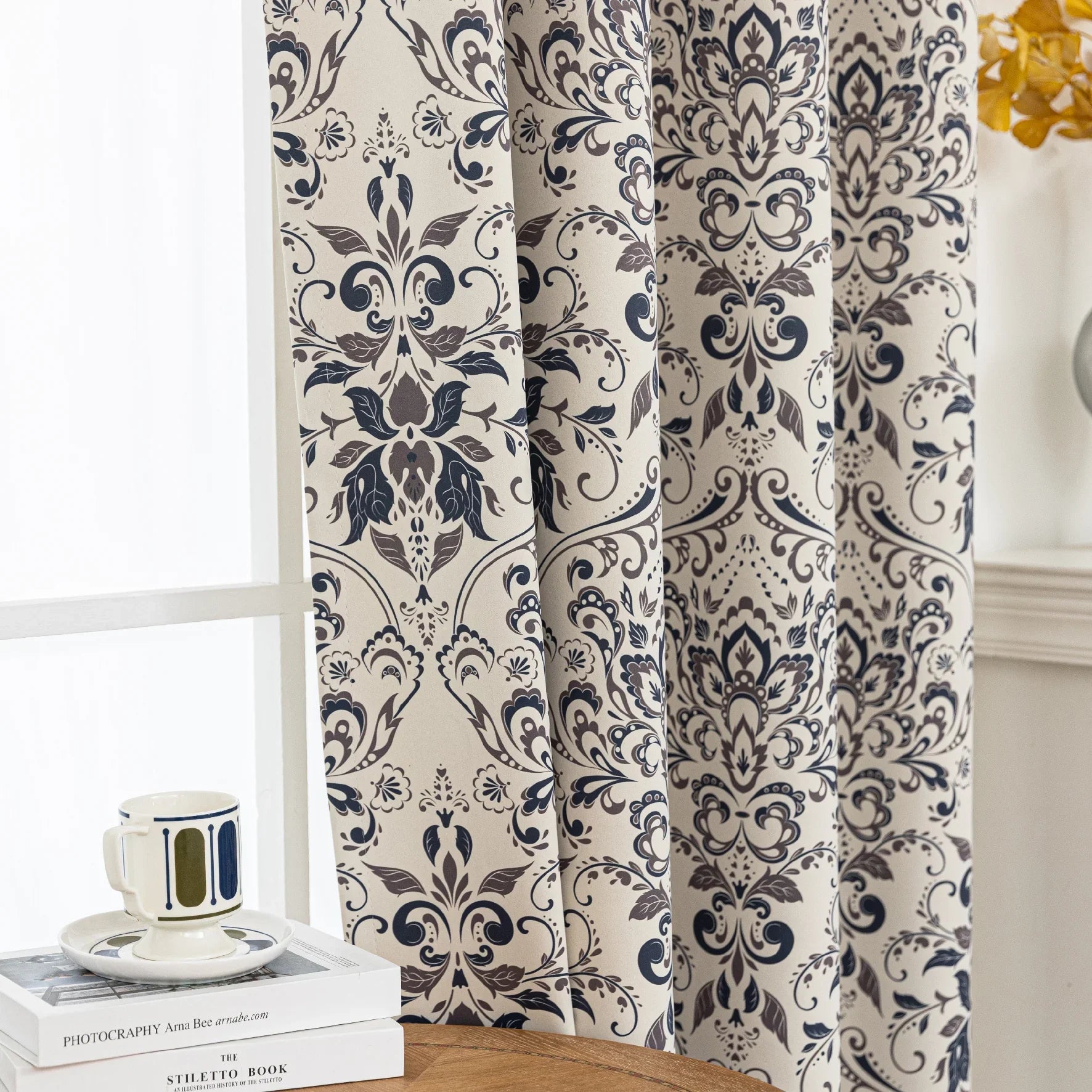 Stylish blackout curtain with an elegant dark floral damask pattern on a neutral beige background, offering excellent light-blocking, privacy, and a timeless touch for modern and classic interiors.