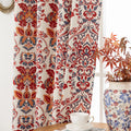 Vibrant blackout curtain featuring an intricate red, orange, and blue damask floral pattern on a soft cream background, designed to block light, enhance privacy, and add a bold, elegant touch to any room décor.