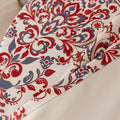 Vibrant blackout curtain featuring an intricate red, orange, and blue damask floral pattern on a soft cream background, designed to block light, enhance privacy, and add a bold, elegant touch to any room décor.
