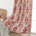 Vibrant blackout curtain featuring an intricate red, orange, and blue damask floral pattern on a soft cream background, designed to block light, enhance privacy, and add a bold, elegant touch to any room décor.