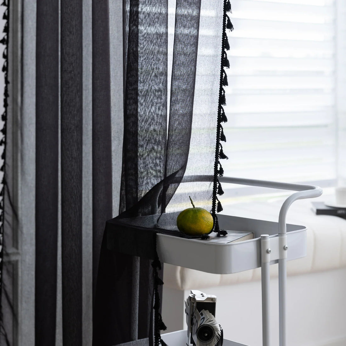 Black Sheer Curtains with Pom Pom Trim – Add modern elegance and soft light control to your space with these lightweight black sheer curtains, featuring a stylish pom pom edge for a chic decorative accent. Perfect for living rooms, bedrooms, or reading nooks, they gently filter sunlight while maintaining privacy, creating a cozy yet sophisticated atmosphere. Easy to match with contemporary or classic décor, these breathable curtains enhance your home with a touch of refined charm.
