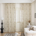 Sheer beige curtains with delicate bird and botanical print in soft brown and green hues, creating an airy, nature-inspired look for French doors in a cozy living room.