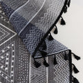 Modern Black and White Geometric Sheer Curtains – Enhance your home with these contemporary sheer curtains featuring an intricate tribal-inspired geometric pattern in black and white. The lightweight fabric allows natural light to filter through while maintaining a sense of privacy, making them perfect for living rooms, bedrooms, or minimalist interiors. Finished with delicate black tassels along the edges, these curtains add a stylish yet subtle decorative touch that complements modern, boho, or Scandinavi