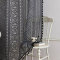 Modern Black and White Geometric Sheer Curtains – Enhance your home with these contemporary sheer curtains featuring an intricate tribal-inspired geometric pattern in black and white. The lightweight fabric allows natural light to filter through while maintaining a sense of privacy, making them perfect for living rooms, bedrooms, or minimalist interiors. Finished with delicate black tassels along the edges, these curtains add a stylish yet subtle decorative touch that complements modern, boho, or Scandinavi