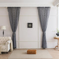 Modern Black and White Geometric Sheer Curtains – Enhance your home with these contemporary sheer curtains featuring an intricate tribal-inspired geometric pattern in black and white. The lightweight fabric allows natural light to filter through while maintaining a sense of privacy, making them perfect for living rooms, bedrooms, or minimalist interiors. Finished with delicate black tassels along the edges, these curtains add a stylish yet subtle decorative touch that complements modern, boho, or Scandinavi