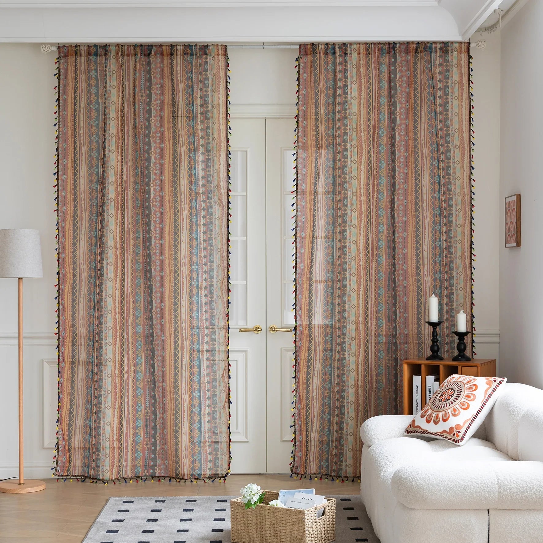 Bring warmth and character to your space with this bohemian tribal-patterned sheer curtain, featuring rich earth tones, geometric motifs, and colorful tassel trim. Crafted from lightweight, breathable fabric, it softly filters sunlight to create a cozy and inviting ambiance while maintaining privacy.