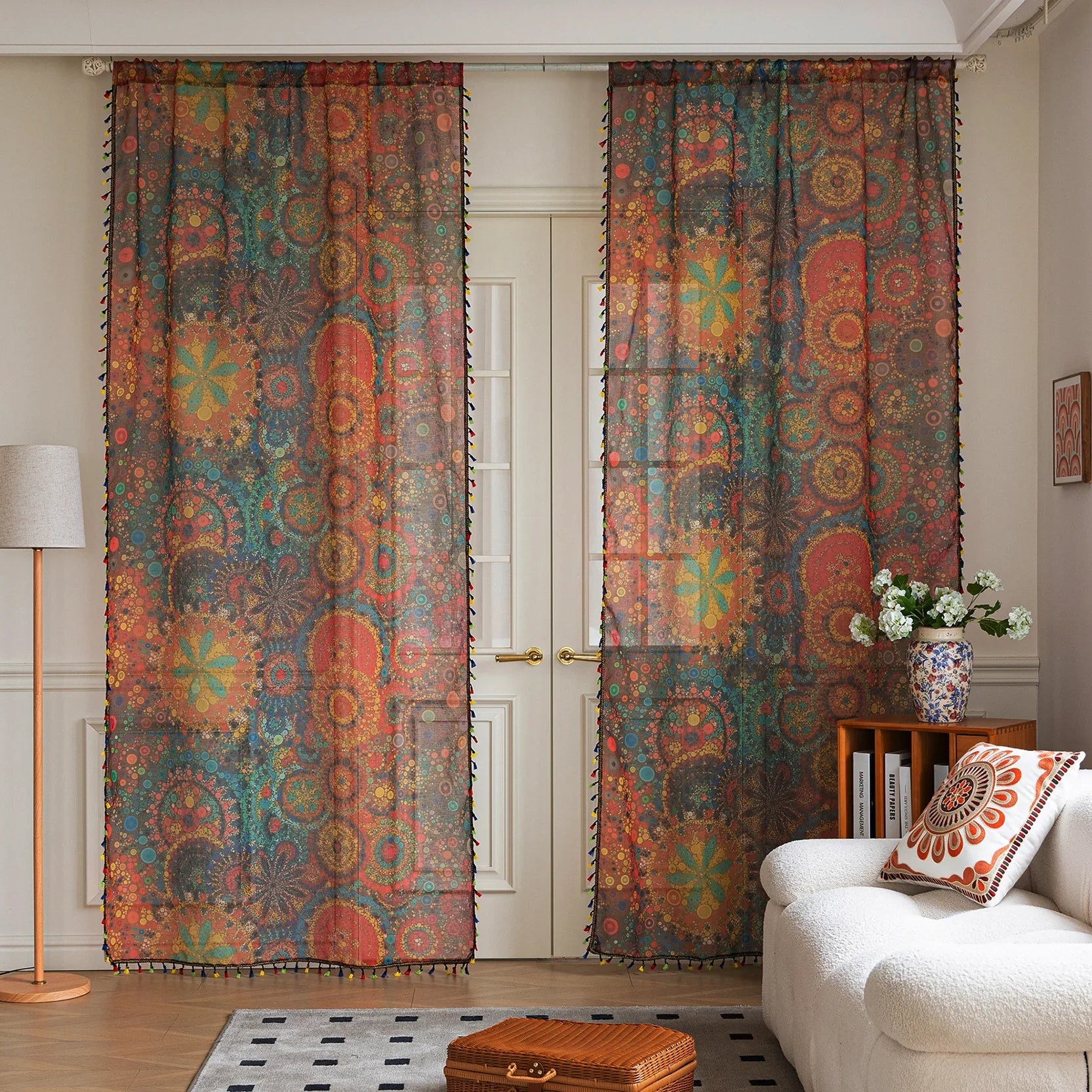 Infuse your home with artistic vibrance using this bohemian sheer curtain, adorned with an intricate mandala and floral pattern in bold reds, yellows, blues, and oranges. Made from lightweight, airy fabric, it filters natural sunlight beautifully while preserving privacy. Perfect for living rooms, bedrooms, or creative spaces, this decorative curtain creates a warm, inviting ambiance.