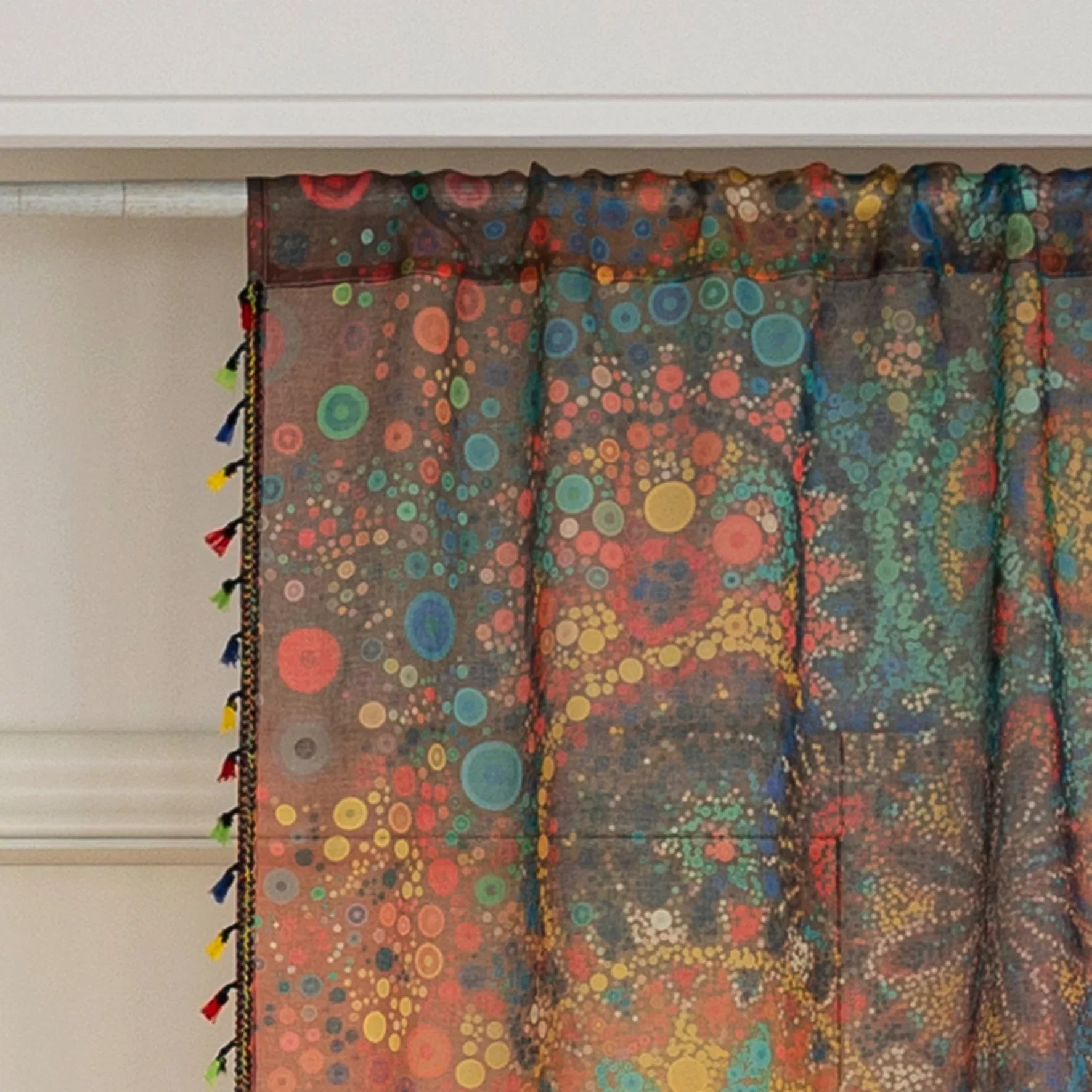 Infuse your home with artistic vibrance using this bohemian sheer curtain, adorned with an intricate mandala and floral pattern in bold reds, yellows, blues, and oranges. Made from lightweight, airy fabric, it filters natural sunlight beautifully while preserving privacy. Perfect for living rooms, bedrooms, or creative spaces, this decorative curtain creates a warm, inviting ambiance.