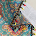 Bring vibrant elegance to your home with this bohemian-style sheer curtain, featuring an intricate geometric pattern in rich teal, orange, and gold tones. Crafted from lightweight, breathable fabric, it allows natural light to filter through while maintaining privacy. Perfect for living rooms, bedrooms, or creative spaces, this decorative curtain adds warmth and personality to any interior. The colorful tassel trim enhances its artisanal charm, making it a versatile choice for both modern and eclectic home 