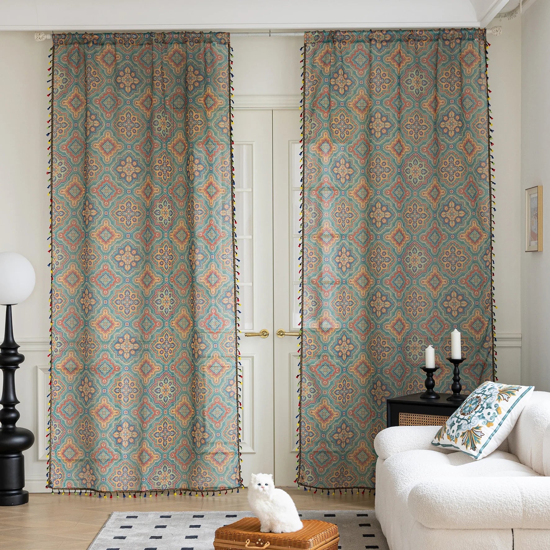 Bring vibrant elegance to your home with this bohemian-style sheer curtain, featuring an intricate geometric pattern in rich teal, orange, and gold tones. Crafted from lightweight, breathable fabric, it allows natural light to filter through while maintaining privacy. Perfect for living rooms, bedrooms, or creative spaces, this decorative curtain adds warmth and personality to any interior. The colorful tassel trim enhances its artisanal charm, making it a versatile choice for both modern and eclectic home 