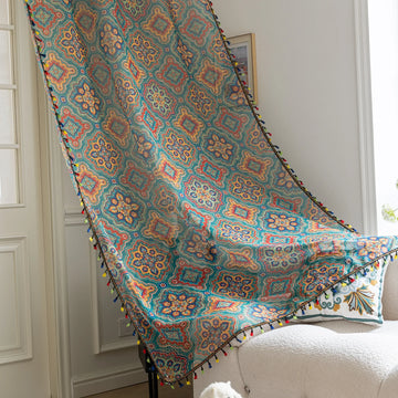 Bohemian Moroccan Print Sheer Curtains – Infuse your home with vibrant charm using these colorful sheer curtains featuring intricate Moroccan-inspired patterns in teal, orange, yellow, and red. Crafted from lightweight fabric, they allow soft light to filter through while adding a burst of personality to your space. Finished with playful multicolor tassel trim, these curtains are perfect for creating a cozy boho vibe in living rooms, bedrooms, or creative studios.
