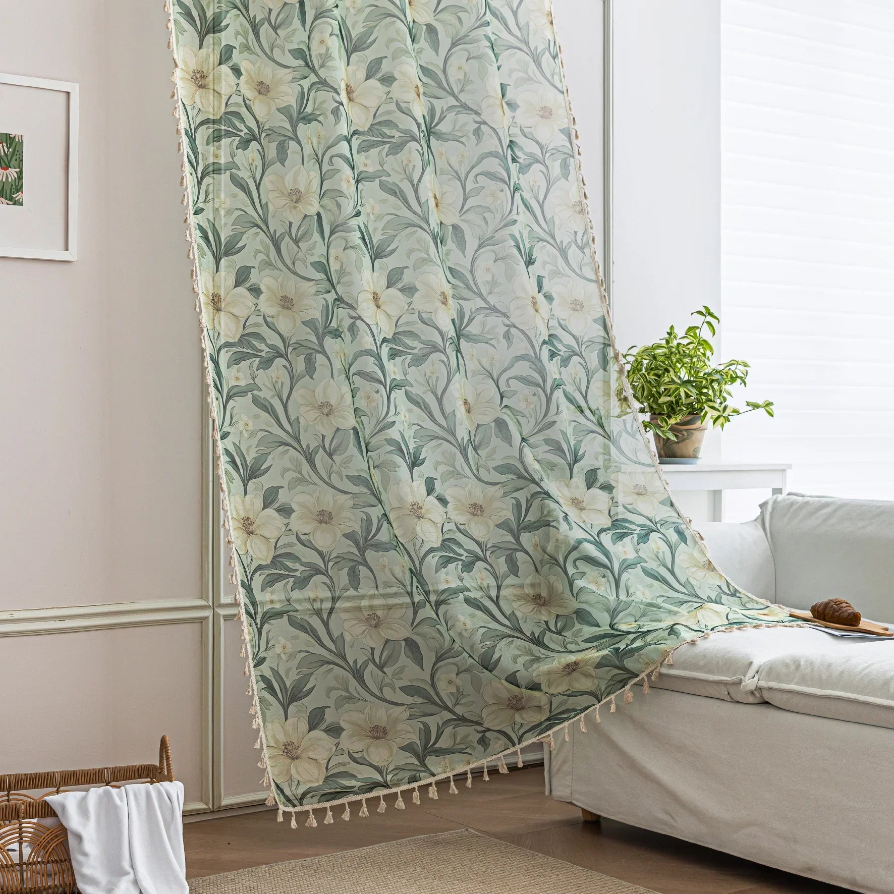 Floral Sheer Curtains with Green Leaves and Cream Blossoms – Bring the beauty of nature indoors with these elegant sheer curtains featuring a delicate pattern of lush green foliage and soft cream flowers. The airy, lightweight fabric allows natural light to filter through while adding a touch of privacy. Finished with charming tassel trim, these curtains are perfect for brightening living rooms, bedrooms, or garden-inspired spaces, creating a fresh and inviting atmosphere.
