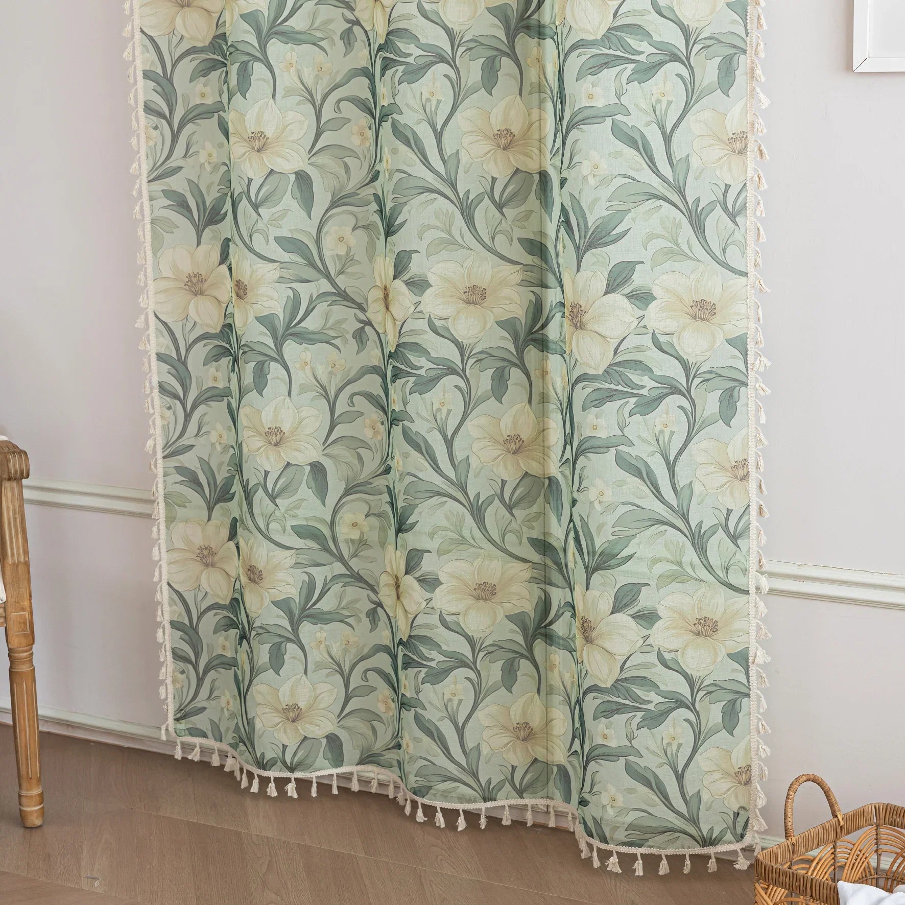 Floral Sheer Curtains with Green Leaves and Cream Blossoms – Bring the beauty of nature indoors with these elegant sheer curtains featuring a delicate pattern of lush green foliage and soft cream flowers. The airy, lightweight fabric allows natural light to filter through while adding a touch of privacy. Finished with charming tassel trim, these curtains are perfect for brightening living rooms, bedrooms, or garden-inspired spaces, creating a fresh and inviting atmosphere.
