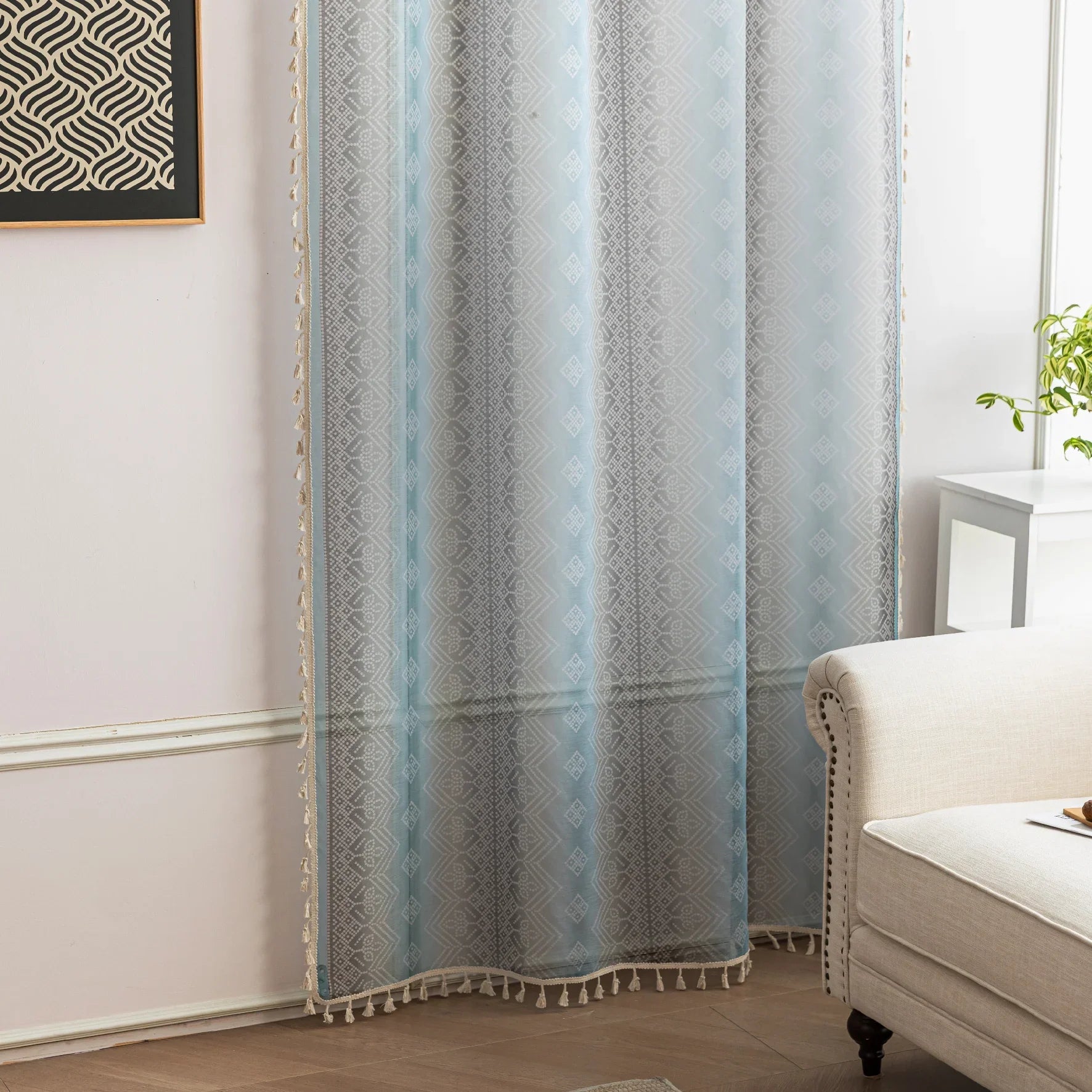 Light Blue Sheer Curtains with Subtle Geometric Pattern – Add a serene and airy touch to your home with these elegant sheer curtains in a soft light blue hue, adorned with a delicate geometric design. The lightweight fabric gently diffuses natural sunlight, brightening your space while maintaining privacy. Finished with charming tassel edges, these curtains are perfect for living rooms, bedrooms, or coastal-themed interiors, creating a calm and stylish ambiance.
