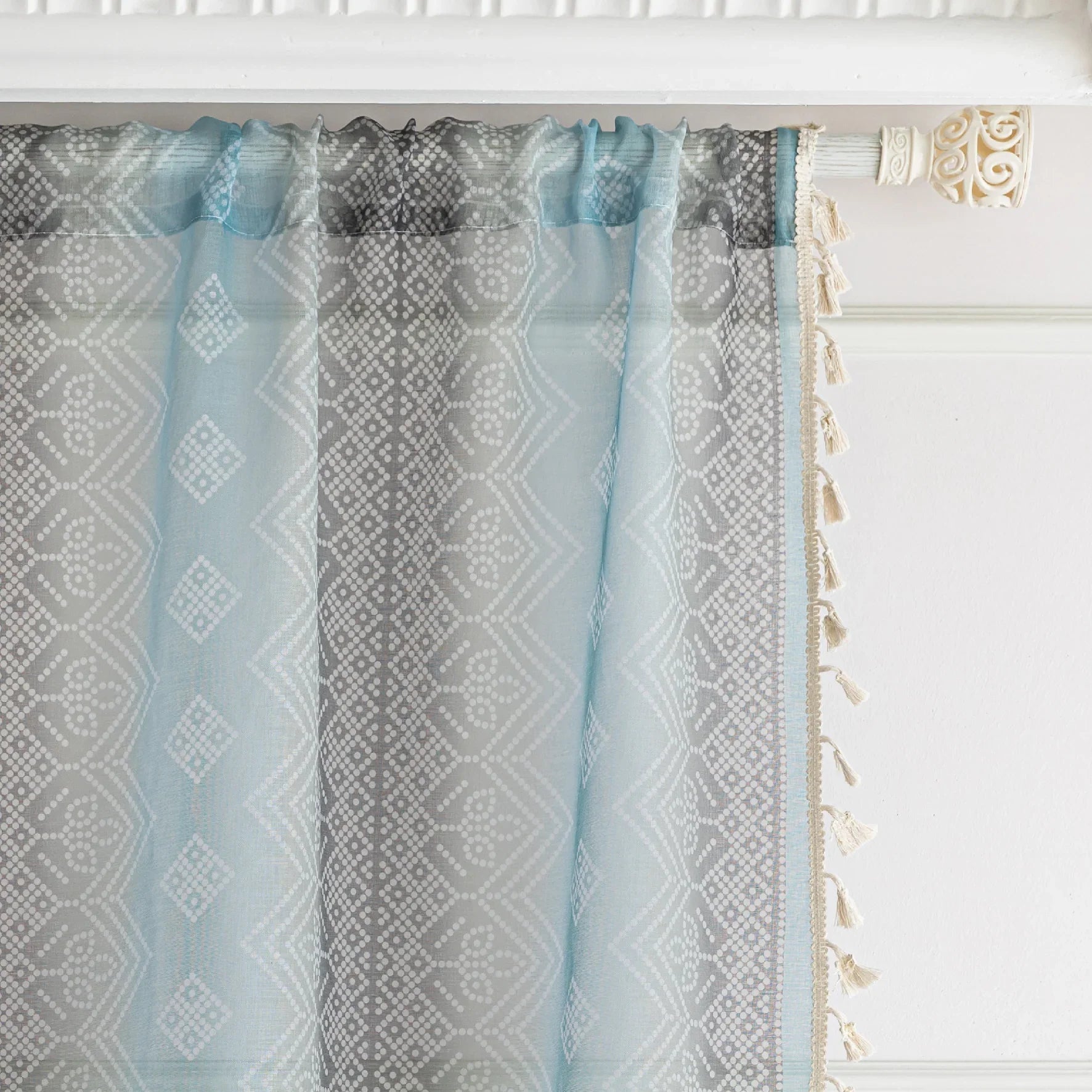 Light Blue Sheer Curtains with Subtle Geometric Pattern ¨C Add a serene and airy touch to your home with these elegant sheer curtains in a soft light blue hue, adorned with a delicate geometric design. The lightweight fabric gently diffuses natural sunlight, brightening your space while maintaining privacy. Finished with charming tassel edges, these curtains are perfect for living rooms, bedrooms, or coastal-themed interiors, creating a calm and stylish ambiance.

