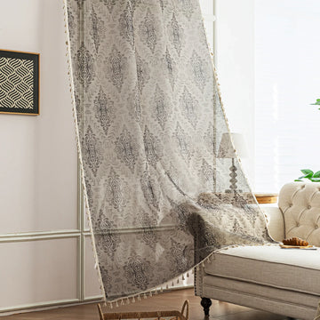 Elegant Beige and Grey Floral Sheer Curtains – Add a touch of timeless charm to your home with these delicate sheer curtains featuring an intricate floral damask pattern in soft grey tones on a warm beige background. Designed to gently filter sunlight while maintaining privacy, these lightweight curtains create an airy and inviting atmosphere, perfect for living rooms, bedrooms, or vintage-inspired interiors. Finished with subtle tassel edging for an extra hint of sophistication.
