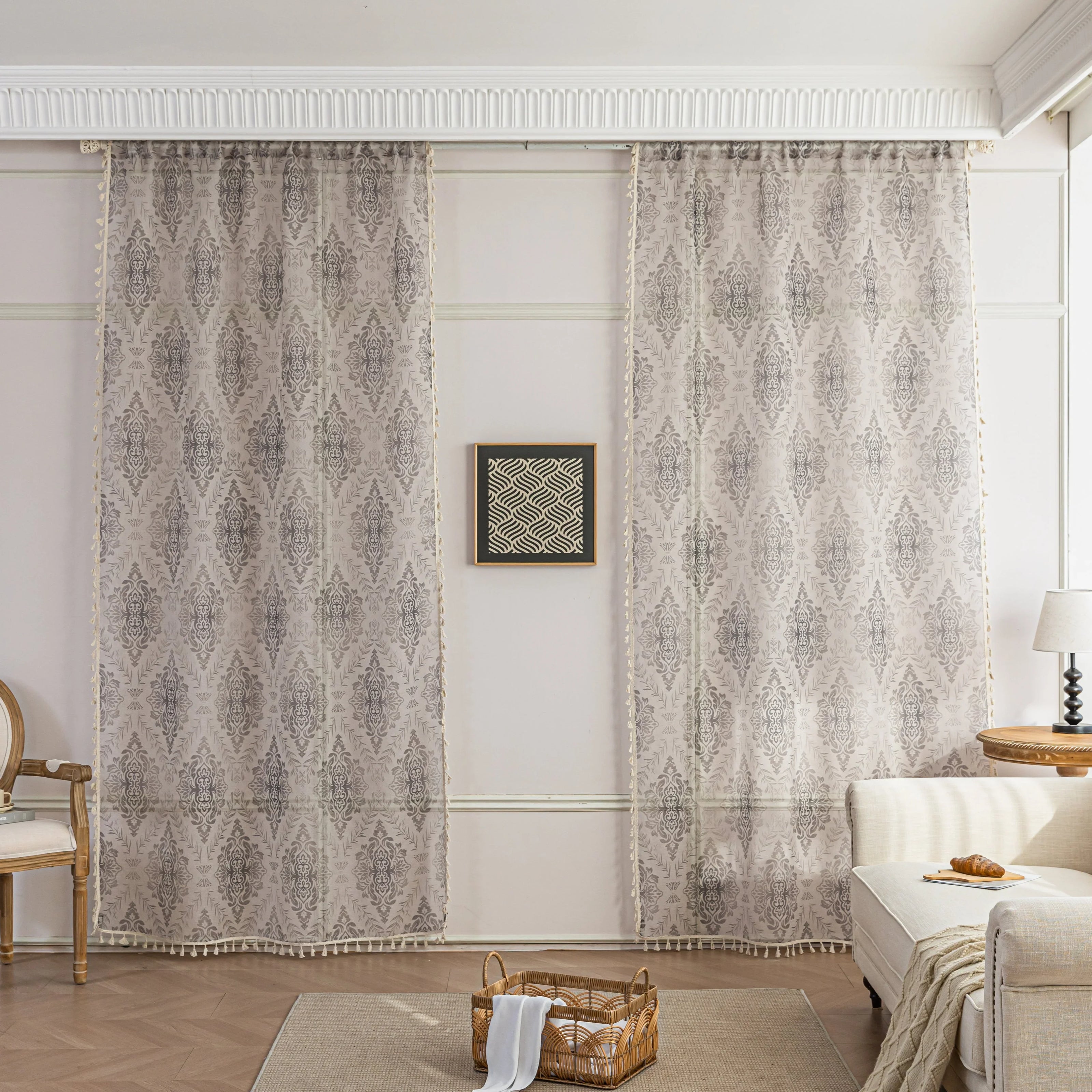 Elegant Beige and Grey Floral Sheer Curtains ¨C Add a touch of timeless charm to your home with these delicate sheer curtains featuring an intricate floral damask pattern in soft grey tones on a warm beige background. Designed to gently filter sunlight while maintaining privacy, these lightweight curtains create an airy and inviting atmosphere, perfect for living rooms, bedrooms, or vintage-inspired interiors. Finished with subtle tassel edging for an extra hint of sophistication.
