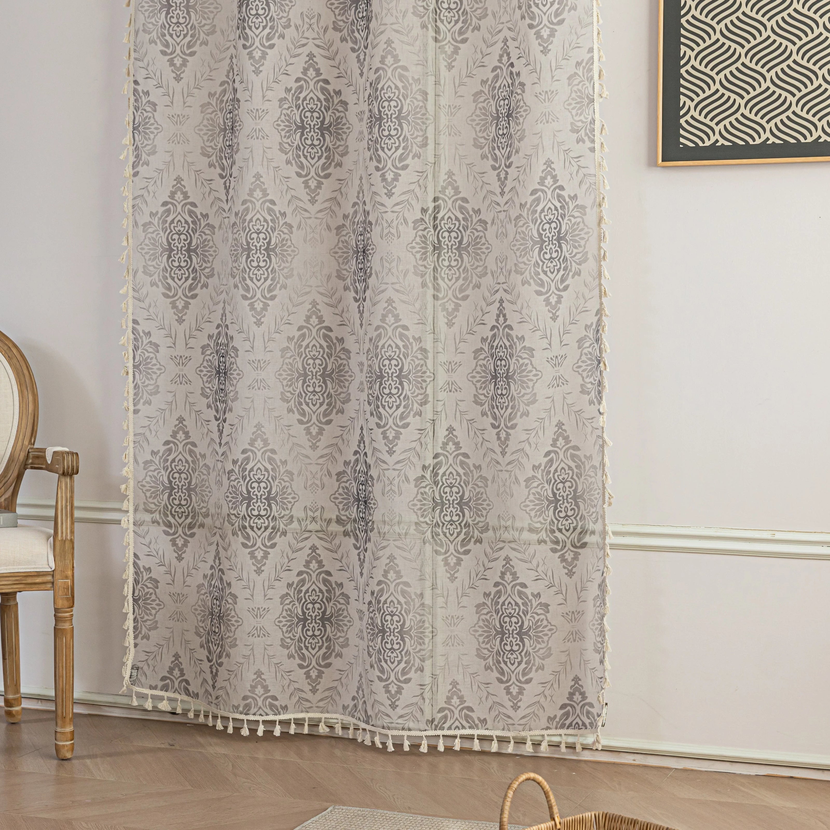 Elegant Beige and Grey Floral Sheer Curtains ¨C Add a touch of timeless charm to your home with these delicate sheer curtains featuring an intricate floral damask pattern in soft grey tones on a warm beige background. Designed to gently filter sunlight while maintaining privacy, these lightweight curtains create an airy and inviting atmosphere, perfect for living rooms, bedrooms, or vintage-inspired interiors. Finished with subtle tassel edging for an extra hint of sophistication.
