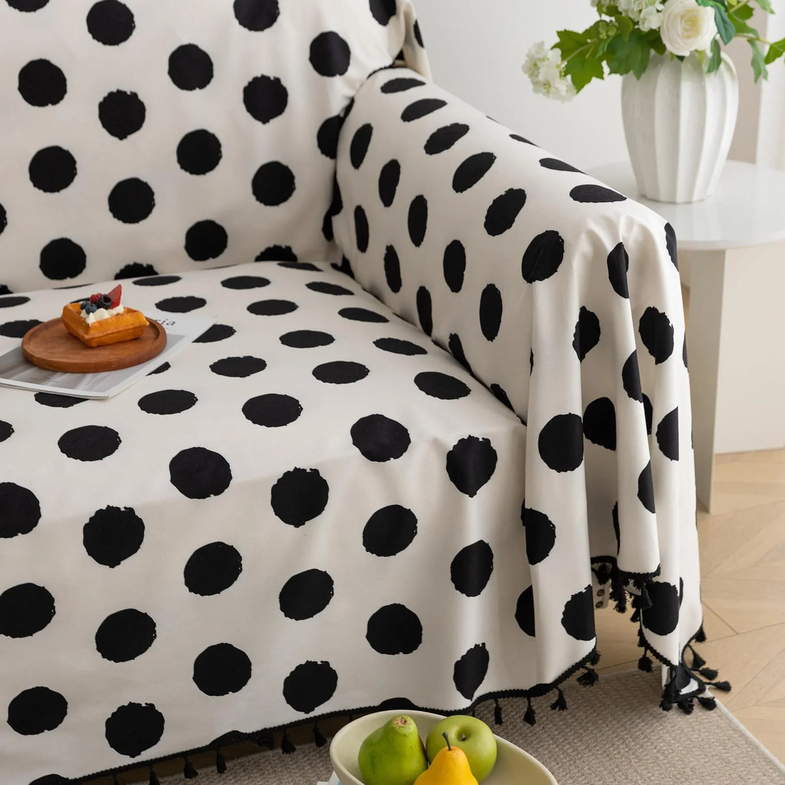 Black and White Polka Dot Sofa Cover – Bring a bold, modern twist to your living space with this eye-catching sofa cover featuring a classic black polka dot pattern on a crisp white background. Crafted from high-quality, soft, and durable fabric, it offers reliable protection against spills, stains, and everyday wear while instantly elevating your home décor. Perfect for contemporary, minimalist, or playful interiors, this slipcover combines functionality with timeless style to give your couch a fresh and f