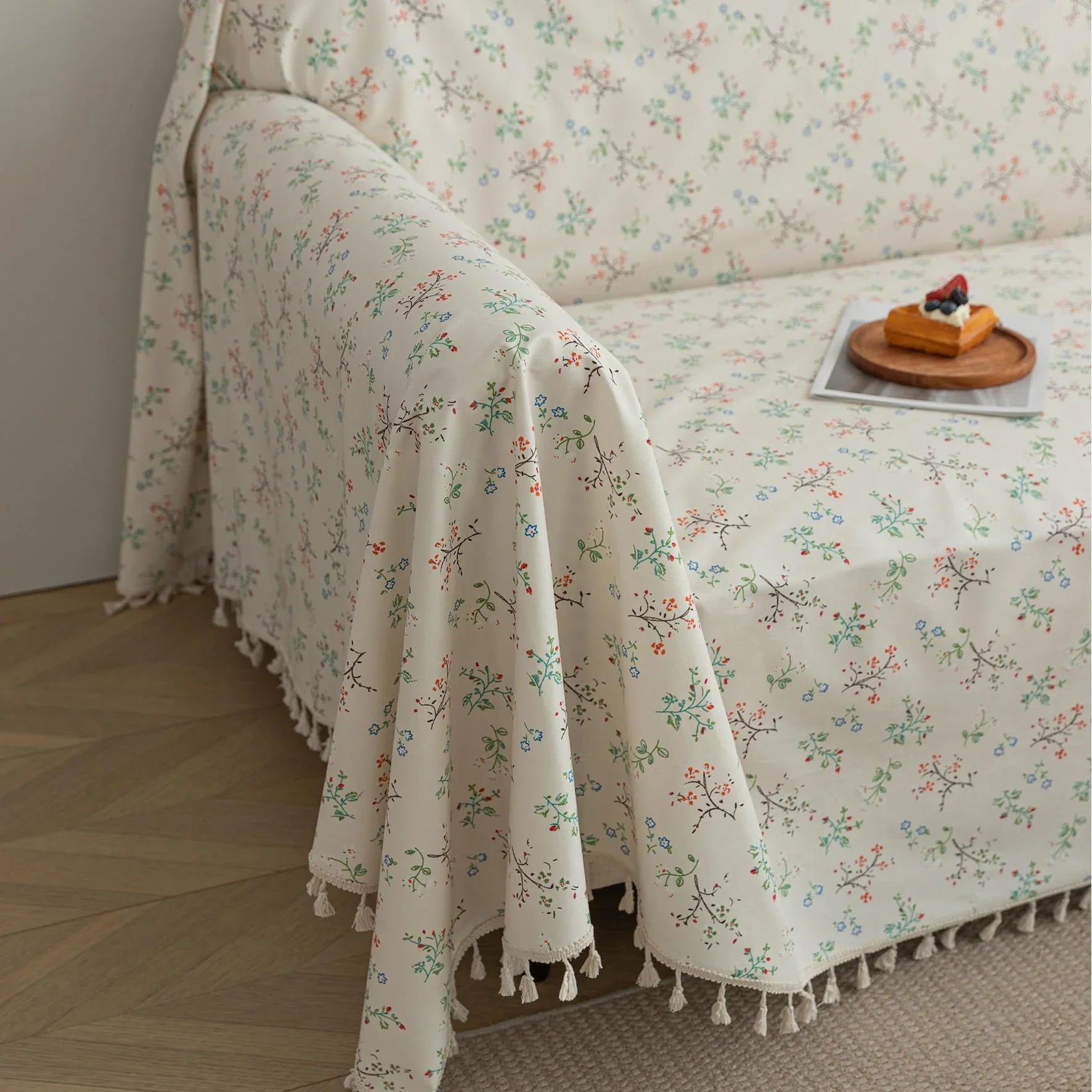Cream Floral Sofa Cover – Add a touch of elegance and charm to your living room with this beautifully designed sofa cover featuring a soft cream background adorned with delicate, multicolored floral sprigs. Made from durable and comfortable fabric, it provides excellent protection against spills, stains, and everyday wear while giving your couch a fresh, cozy makeover. Perfect for vintage, cottage, or minimalist interiors, this slipcover blends timeless beauty with practical functionality for a stylish and 