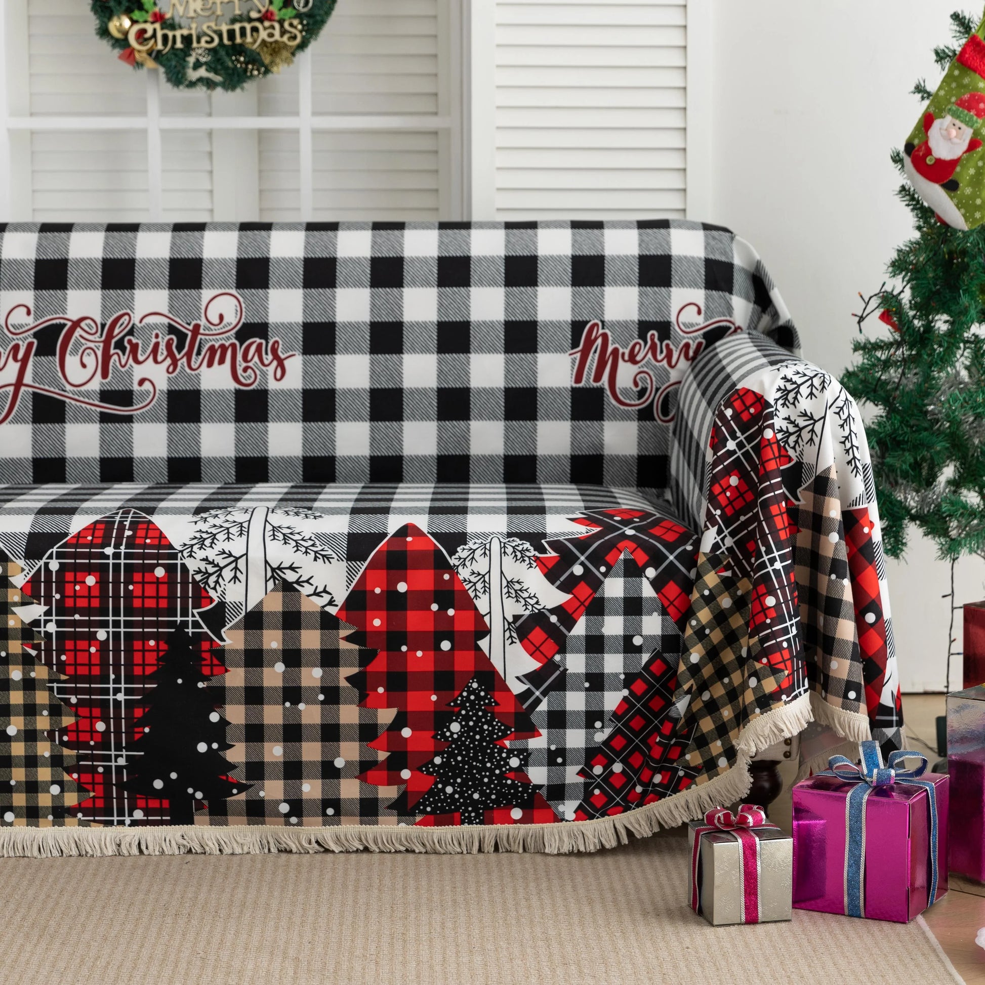Christmas Plaid Sofa Cover – Bring holiday cheer to your home with this cozy black-and-white buffalo check sofa cover, featuring festive “Merry Christmas” lettering and colorful patchwork Christmas tree patterns in red, black, and beige tartan designs. Made from soft, durable fabric with decorative fringe edges, it protects your couch from spills, dust, and wear while adding a warm, seasonal touch. Perfect for winter décor, Christmas parties, and farmhouse-style interiors, this slipcover combines function a