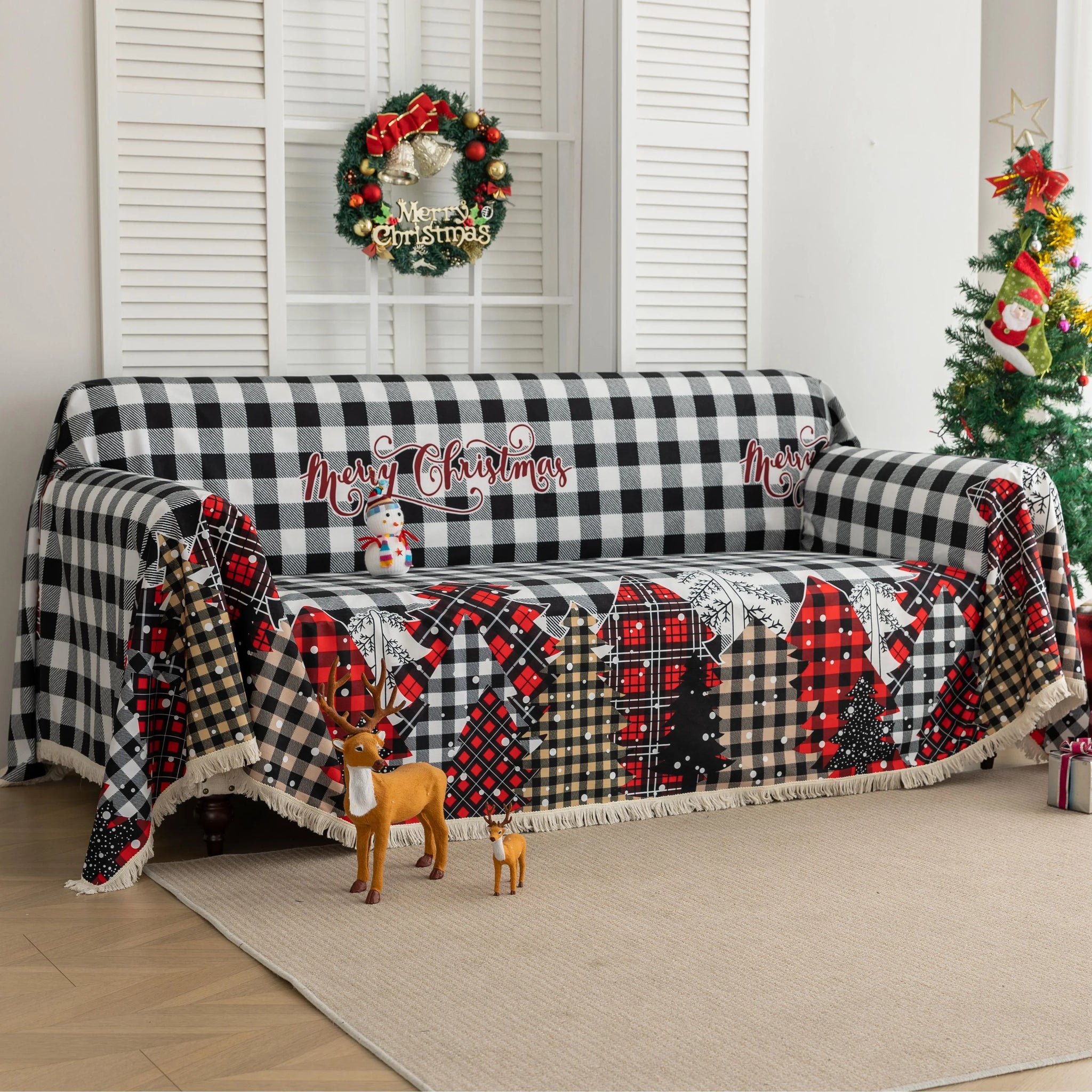 Christmas Plaid Sofa Cover – Bring holiday cheer to your home with this cozy black-and-white buffalo check sofa cover, featuring festive “Merry Christmas” lettering and colorful patchwork Christmas tree patterns in red, black, and beige tartan designs. Made from soft, durable fabric with decorative fringe edges, it protects your couch from spills, dust, and wear while adding a warm, seasonal touch. Perfect for winter décor, Christmas parties, and farmhouse-style interiors, this slipcover combines function a