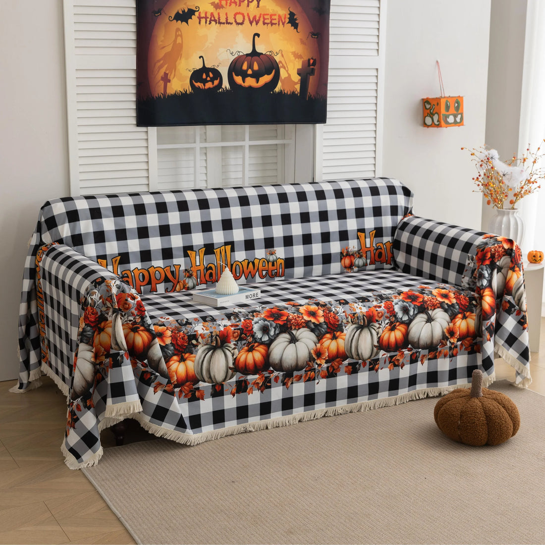 Halloween Pumpkin Plaid Sofa Cover – Give your living room a festive autumn makeover with this black-and-white buffalo check sofa cover, adorned with vibrant pumpkins, sunflowers, and “Happy Halloween” lettering. Crafted from soft, durable fabric with decorative fringe, it protects your couch from dust, spills, and wear while adding a cozy seasonal charm. Perfect for fall décor, Halloween parties, and farmhouse-style interiors, this easy-to-clean slipcover brings warmth and holiday spirit to any space.
