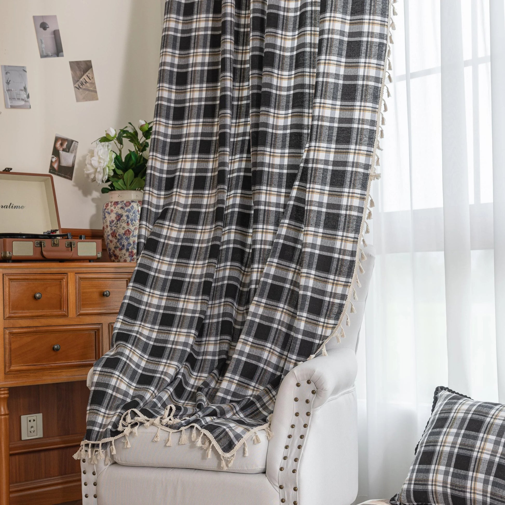 Black, gray, and beige plaid curtain fabric with a soft, woven texture and classic checkered pattern.