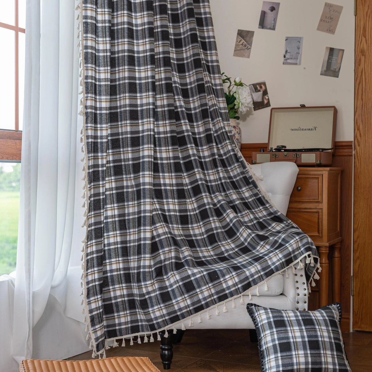 Black, gray, and beige plaid curtain fabric with a soft, woven texture and classic checkered pattern.