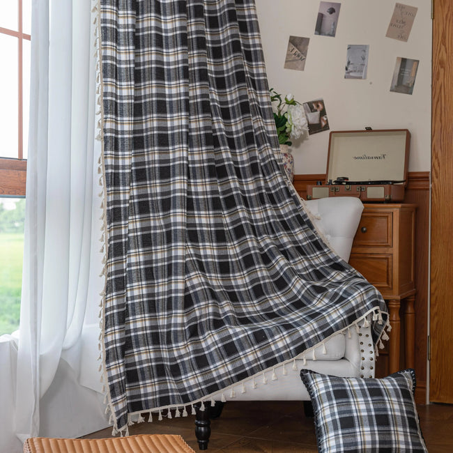 Black, gray, and beige plaid curtain fabric with a soft, woven texture and classic checkered pattern.