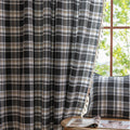 Black, gray, and beige plaid curtain fabric with a soft, woven texture and classic checkered pattern.