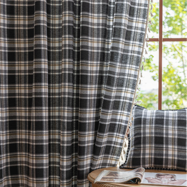 Black, gray, and beige plaid curtain fabric with a soft, woven texture and classic checkered pattern.
