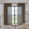 Beige and navy blue plaid curtain fabric with a soft, textured weave and decorative white tassel trim along the edge.