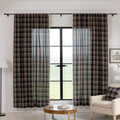 Elegant black plaid curtain fabric featuring intersecting thin white and subtle red lines, creating a classic tartan pattern.