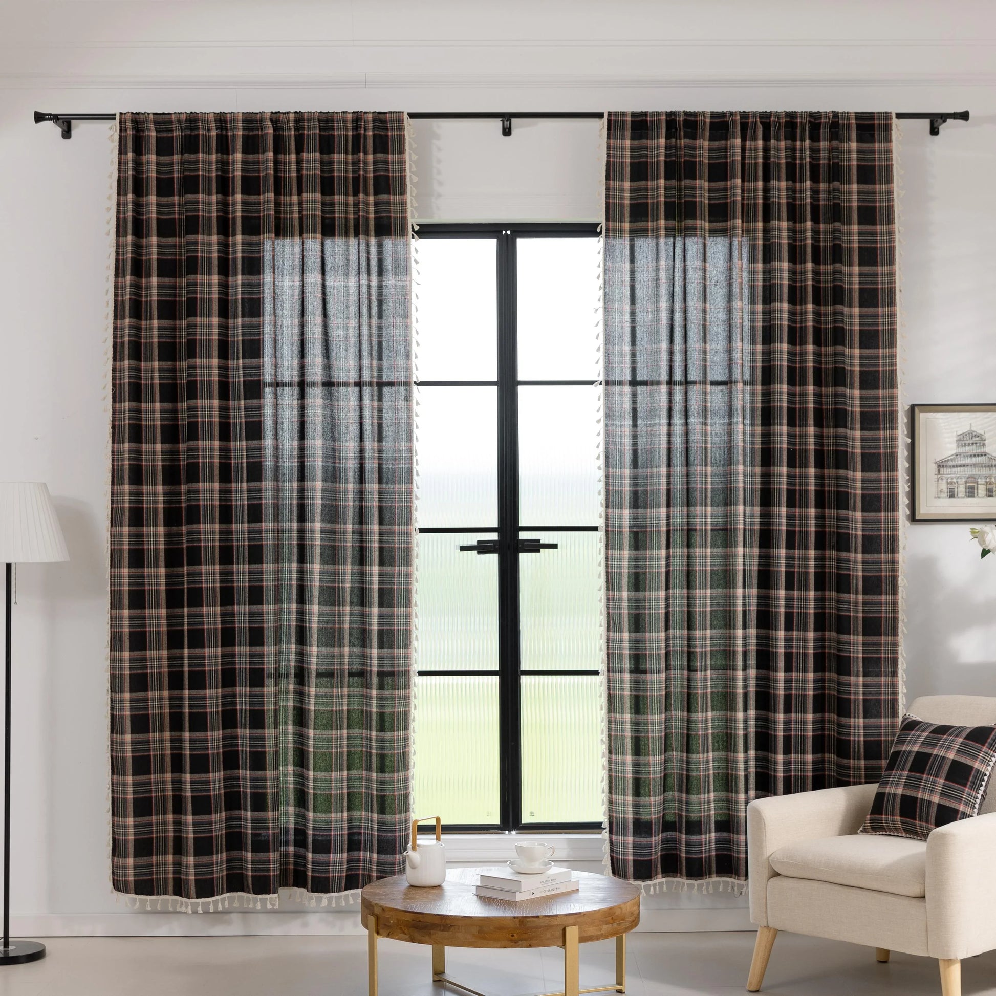 Elegant black plaid curtain fabric featuring intersecting thin white and subtle red lines, creating a classic tartan pattern.