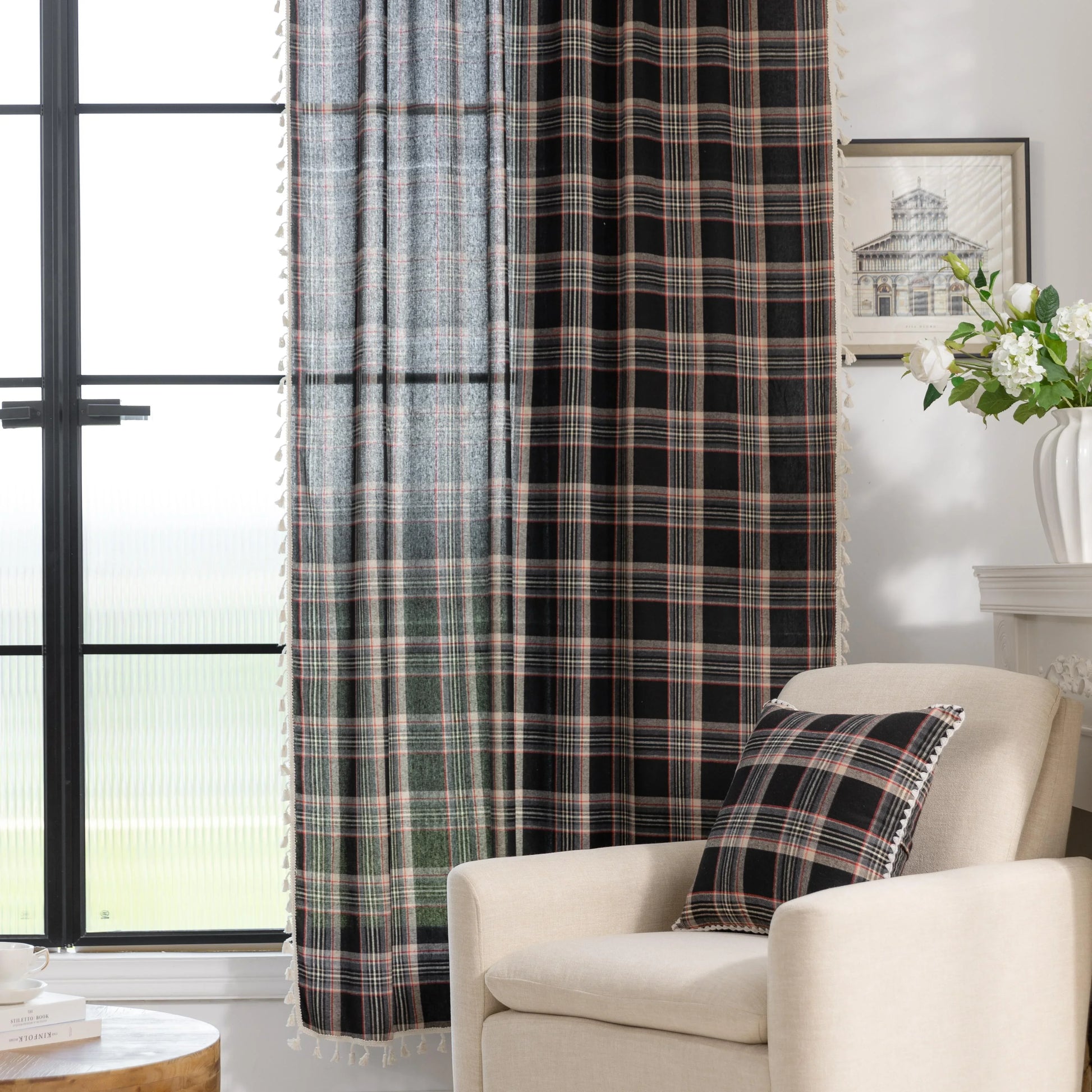 Elegant black plaid curtain fabric featuring intersecting thin white and subtle red lines, creating a classic tartan pattern.